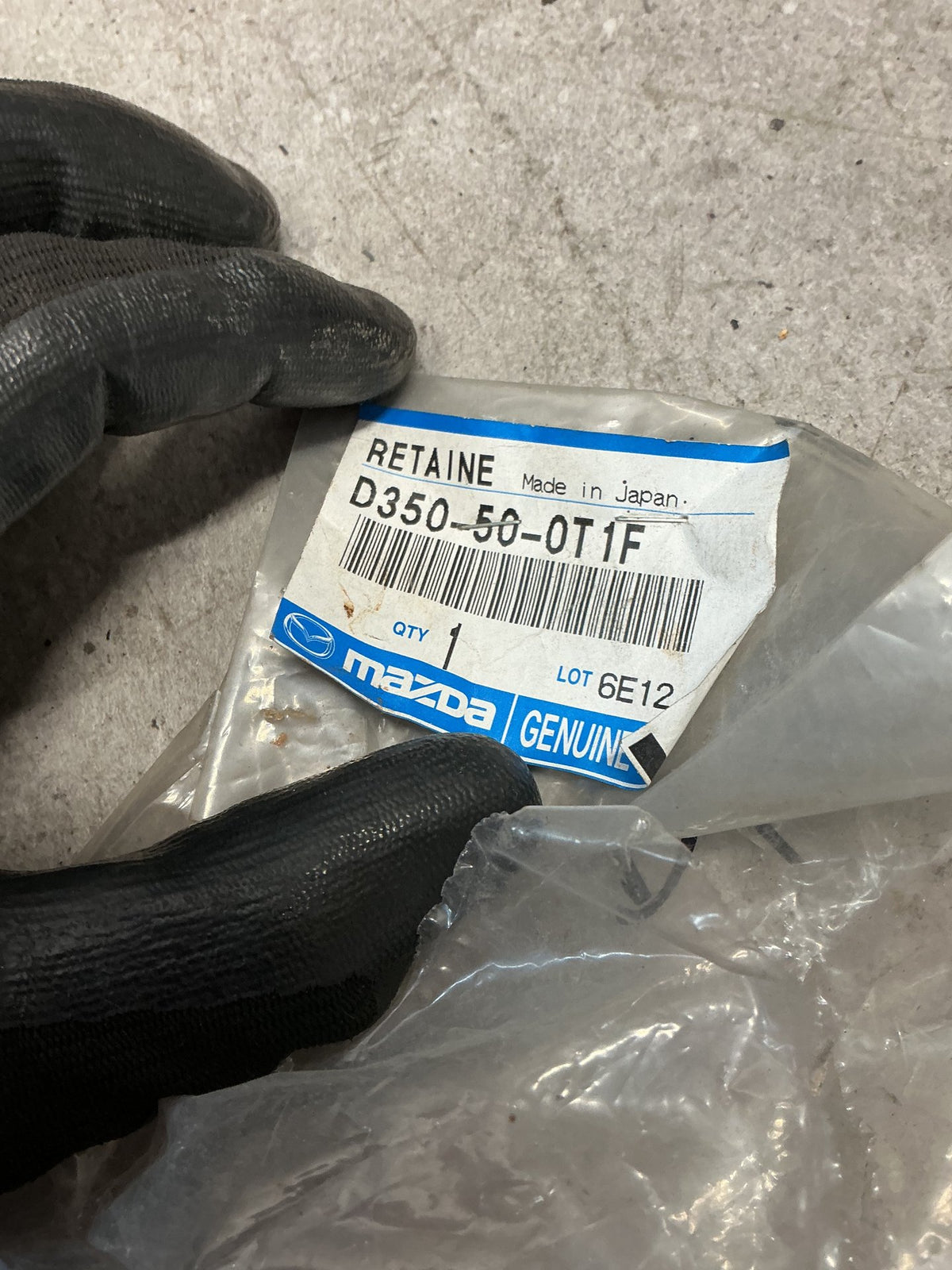 2005 Mazda Demio- Right Front Bumper Retainer- (TAG14222)