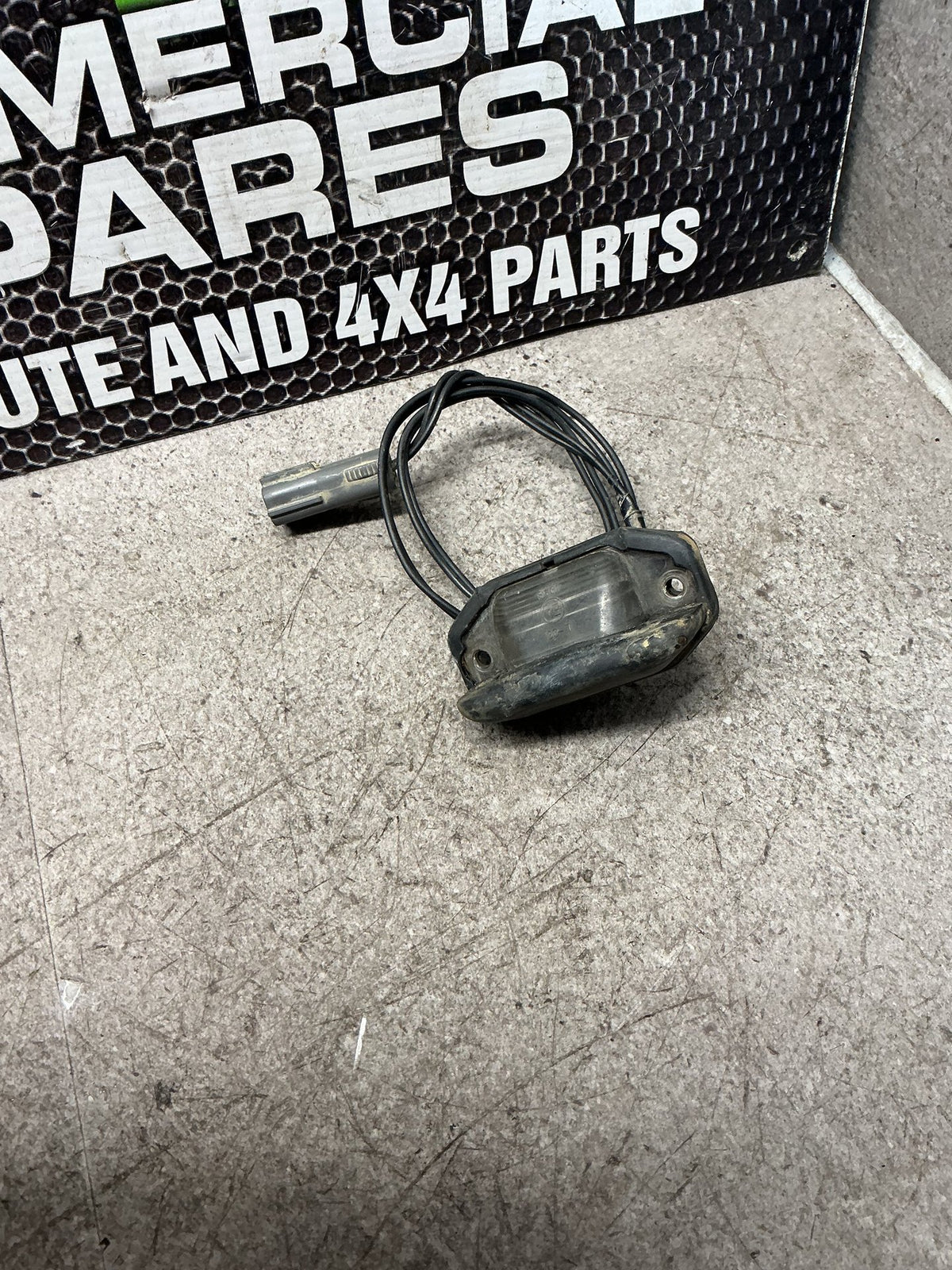 2002 Ford Courier UN- Number Plate Lamp- (TAG16602)